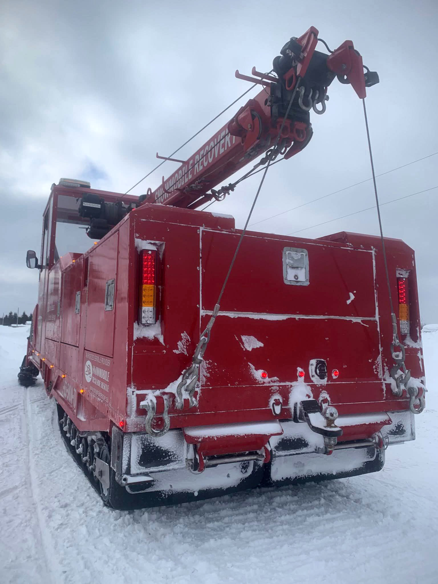 STAR Towing snowmobile wrecker built on Alpina Sherpa dual-track platform