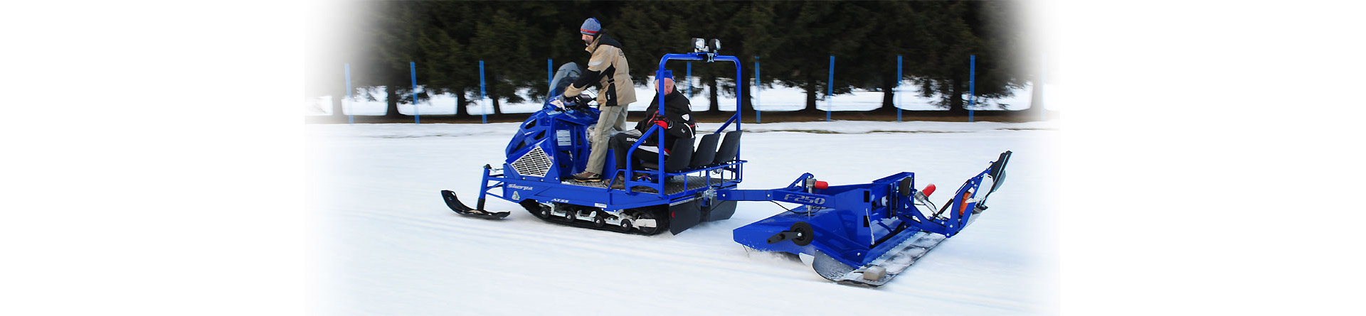 Alpina Sherpa with F-250 groomer: professional work snowmobiles for Nordic ski trail grooming and track setting.
