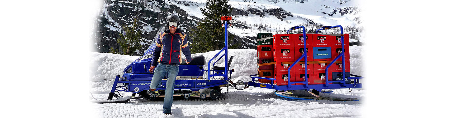Alpina Sherpa with Transalp sled: heavy-duty work snowmobiles for professional transport and logistics.
